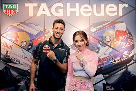 Daniel Ricciardo and G.E.M. showing off their Tag Heuer timepieces. 