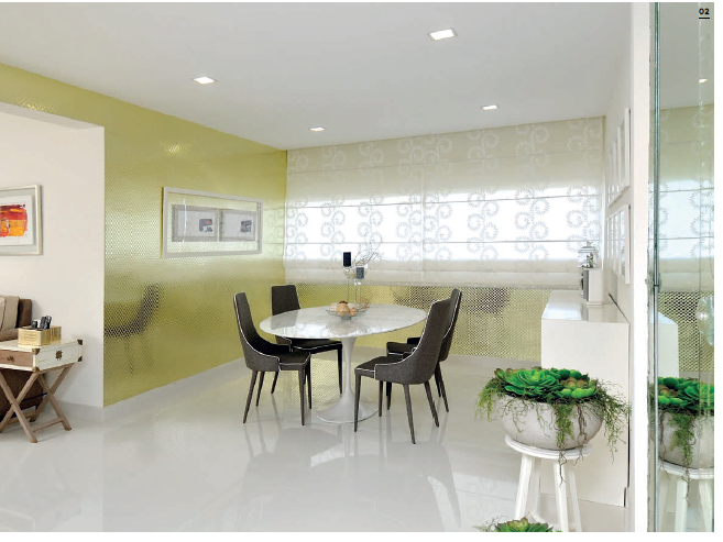 Reflective wallpaper adds a touch of luxury while enhancing the light-filled dining area.