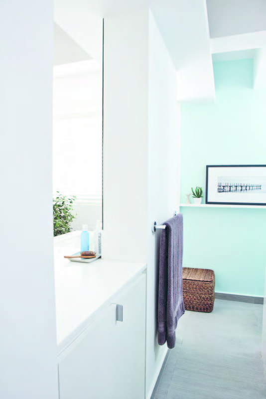 The sink was moved out of the shower area and into the walkway, to open up the space.