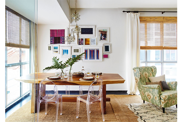 Elly loves a good juxtaposition; such as pairing modern lucite Ghost chairs with the organic natural curves of the Suar wood dining table. The wingback armchair was specially upholstered in a duck-egg ikat fabric.