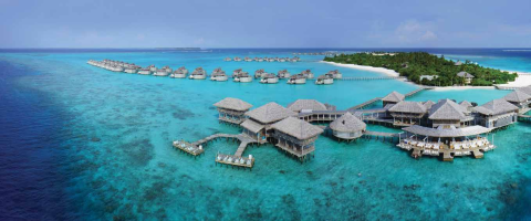 THIS page : Pictureperfect backdrop for morning yoga. OPPOSITE page : The oustanding spa is a resort must; breathtaking Laamu Atoll