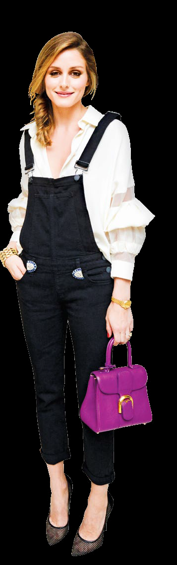 Olivia Palermo contrasts her overalls beautifully.