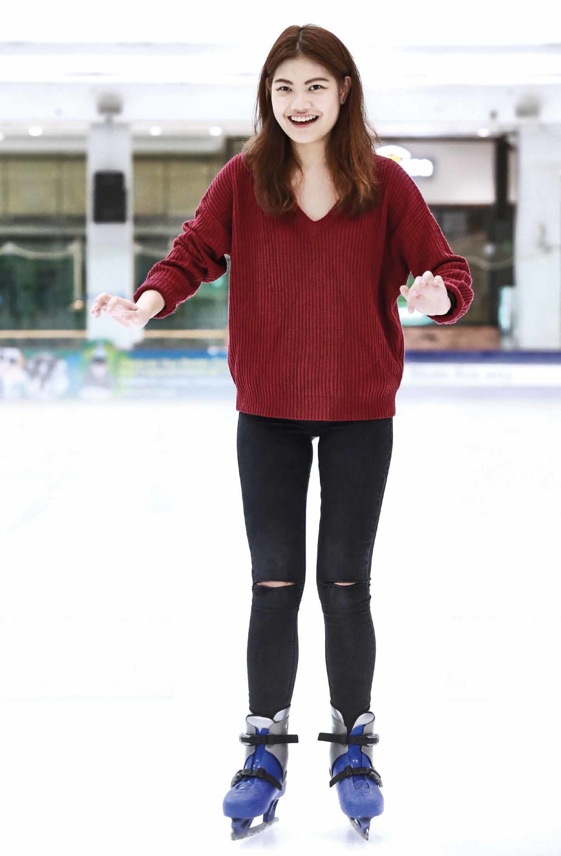 Claire is all smiles after getting the hang of ice skating.