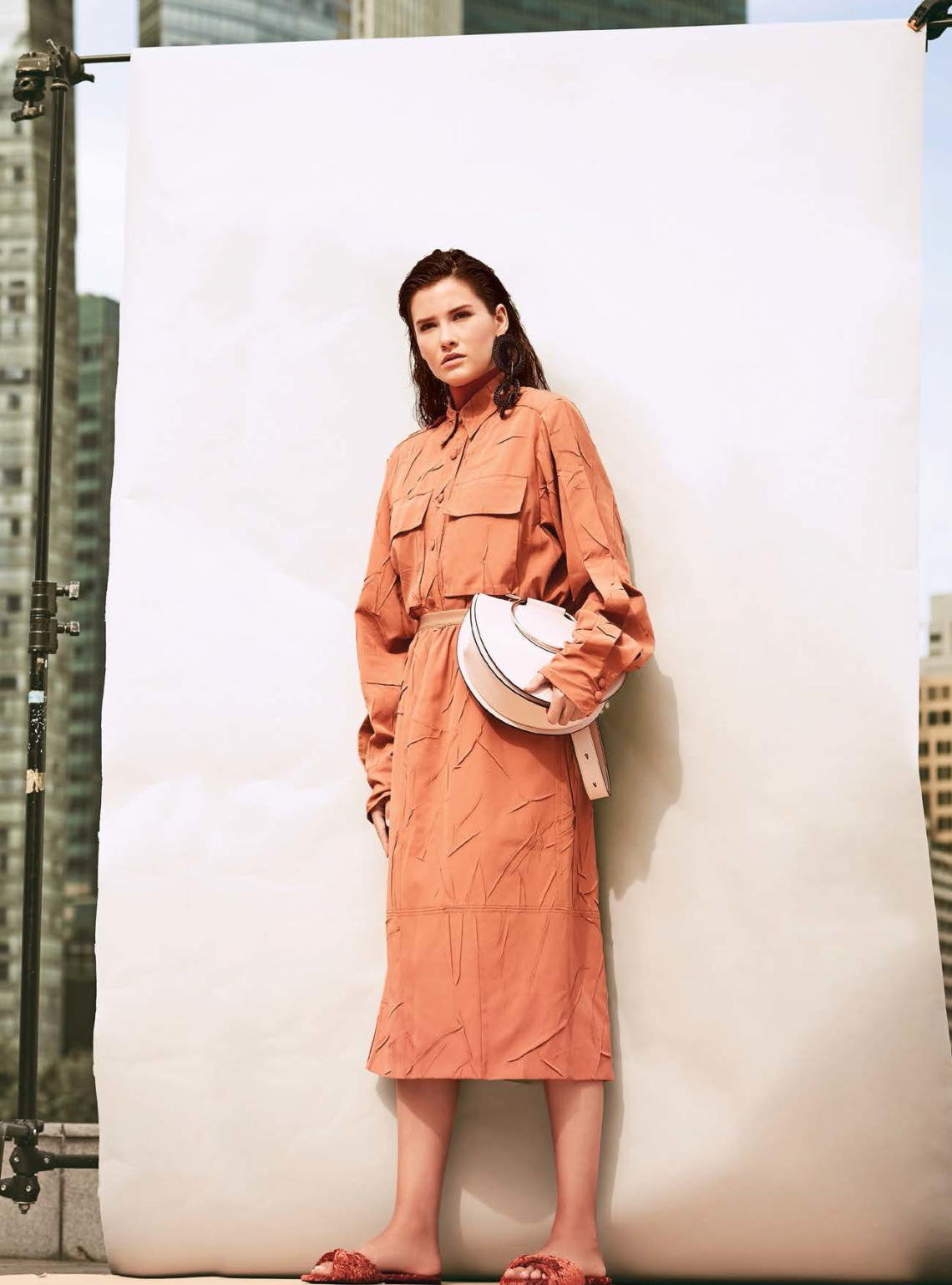 Blouse and skirt, both from Joseph. Turtleneck top from COS. Bag, $2,550, from Salvatore Ferragamo. Earrings, $125; and sandals, $320, both from Bimba Y Lola.