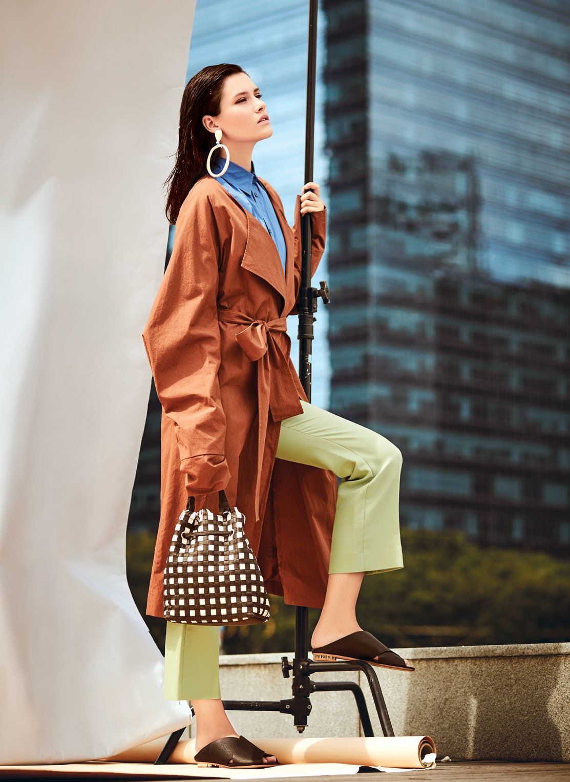 Coat, $275, from COS. Blouse and pants, both from Sandro. Earrings from Bimba Y Lola. Handbag, $785, from Furla. Sandals, $870, from Salvatore Ferragamo.