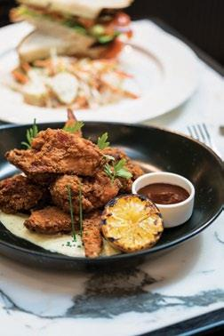 Buttermilk Fried Chicken drizzled with smoked jalapeno aioli and barbecue sauce.